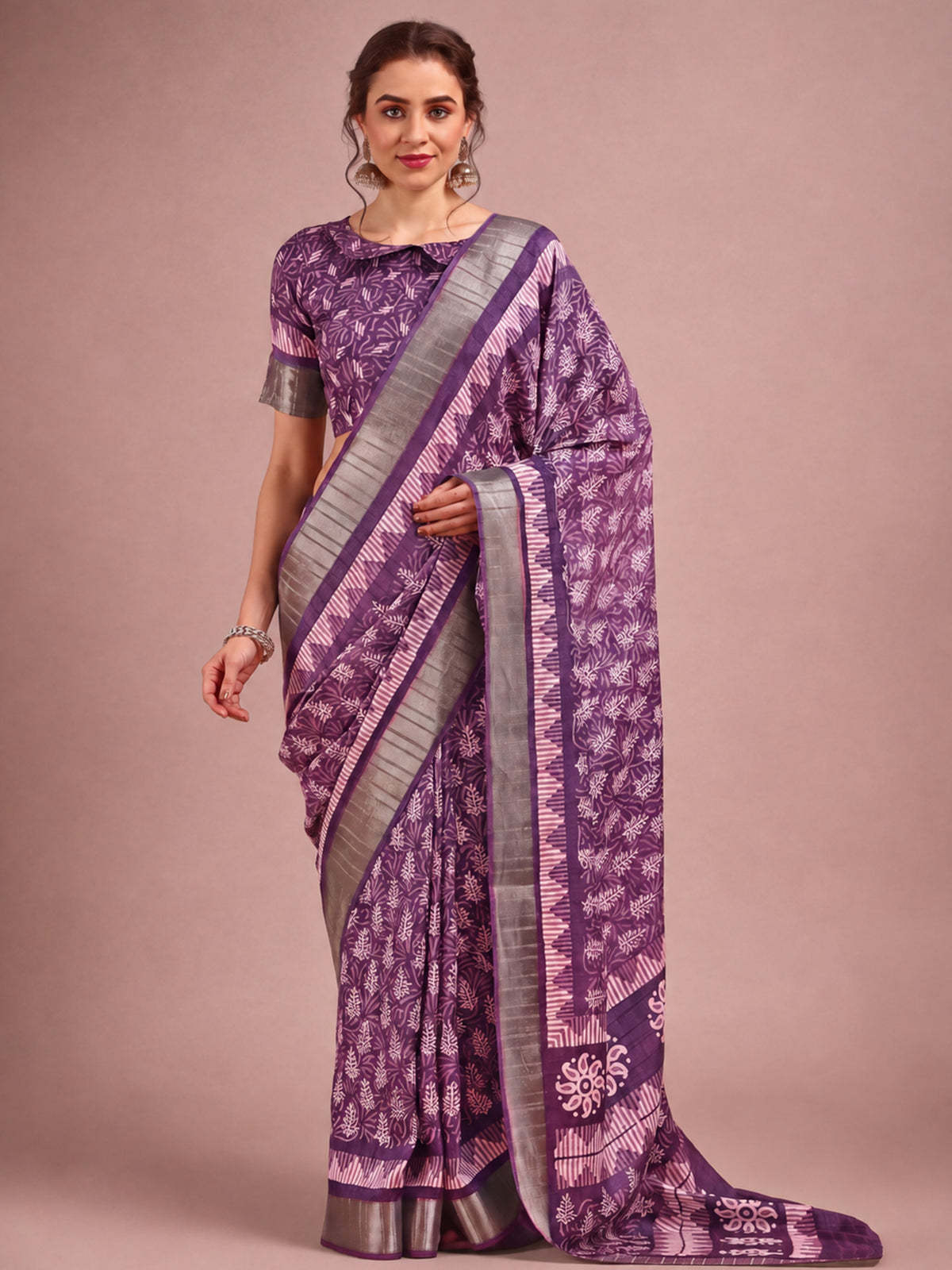 Woman wearing violet cotton silk saree with traditional indian motif work and violet blouse