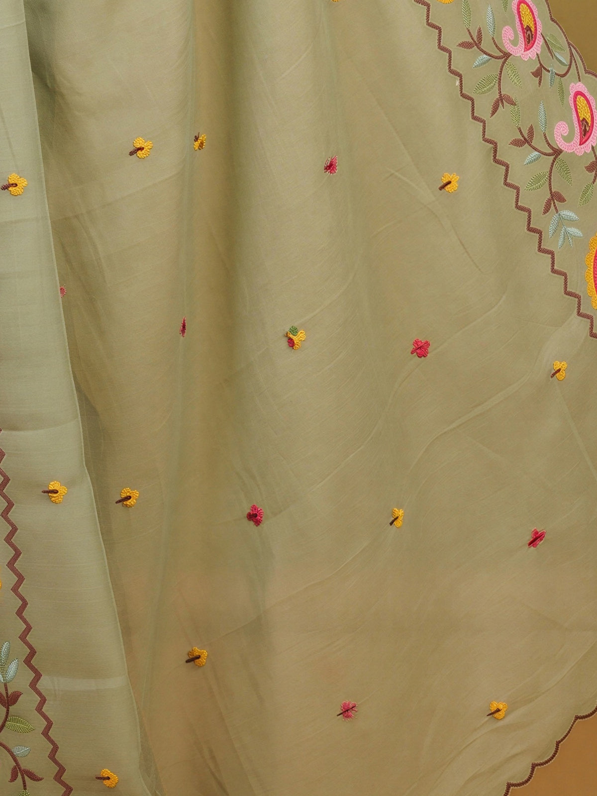 Pallu detail of sea green georgette saree showing embroidered motif work and embroidered border