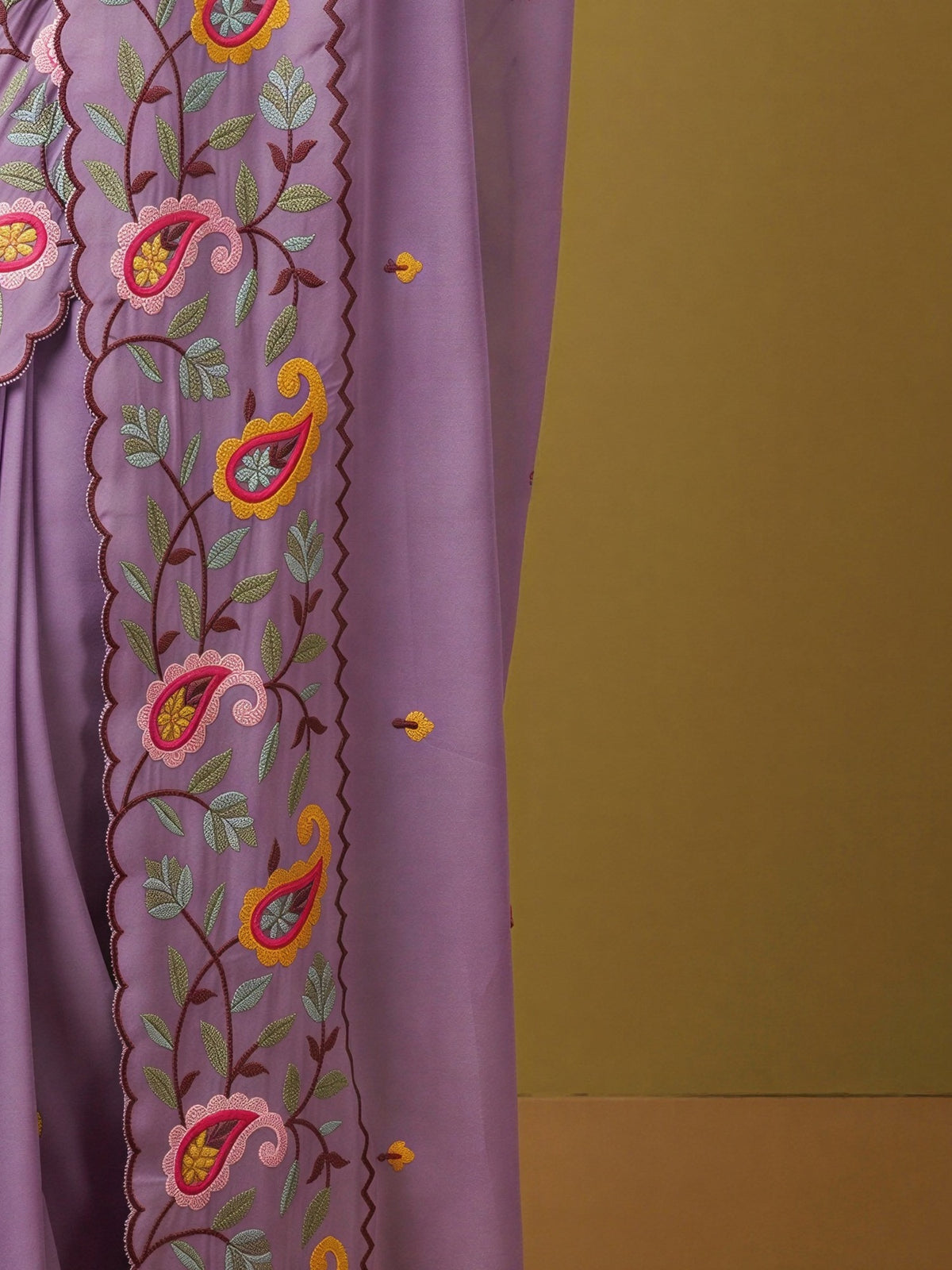 Pallu detail of lavender georgette saree showing embroidered motif work and embroidered border