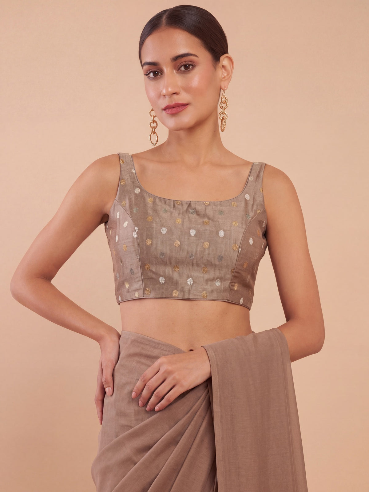 Beige zari woven georgette sleeveless readymade saree blouse with round neck