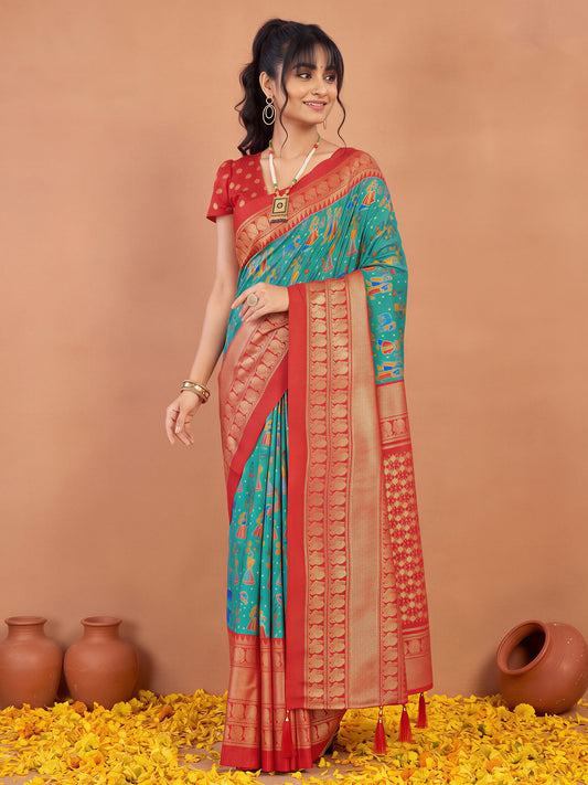 Woman wearing light blue cotton blend saree with traditional indian motif work and red blouse