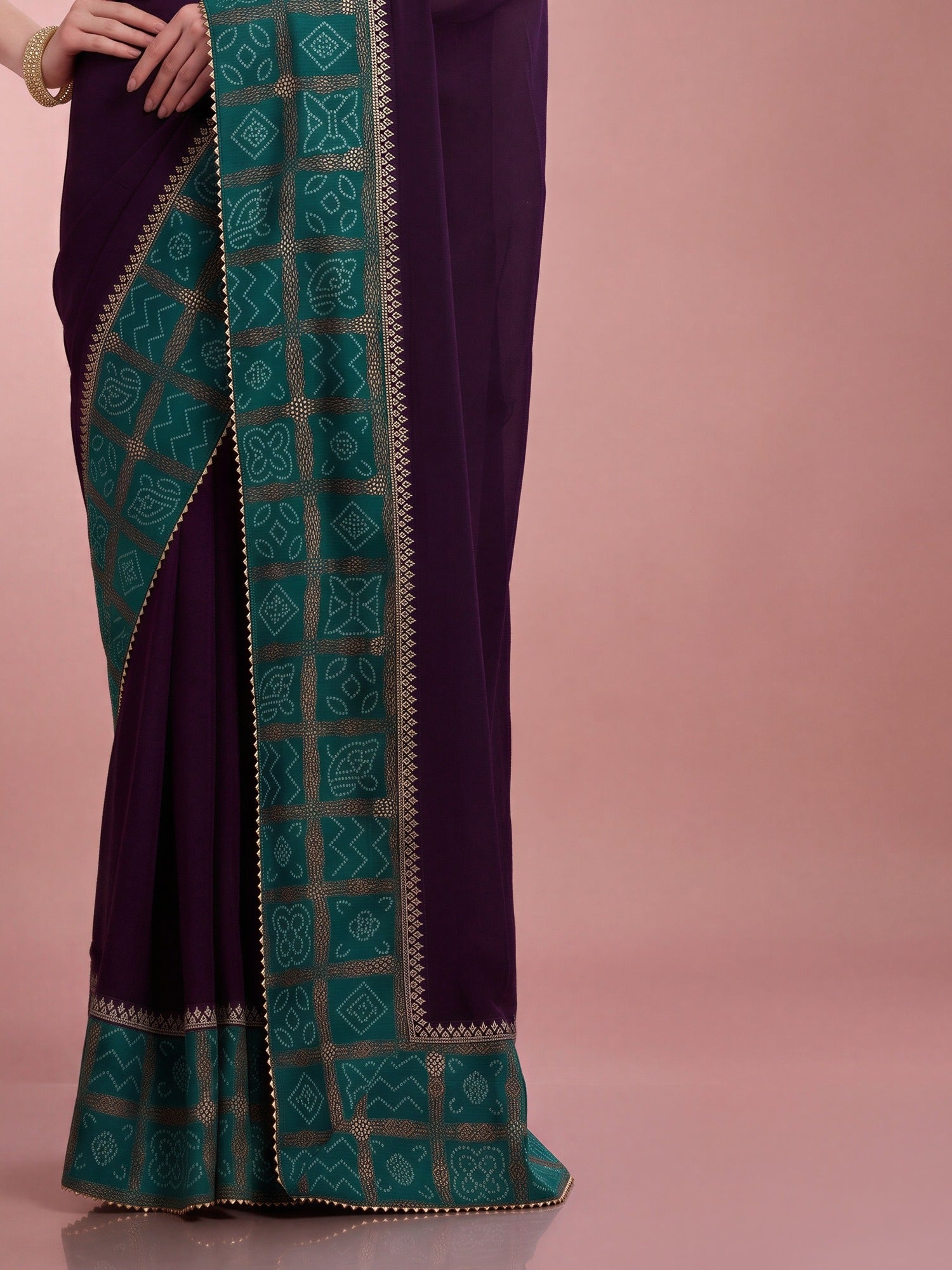 Pallu detail of purple vichitra silk saree showing bandhani tie-dye dot work and embellished border