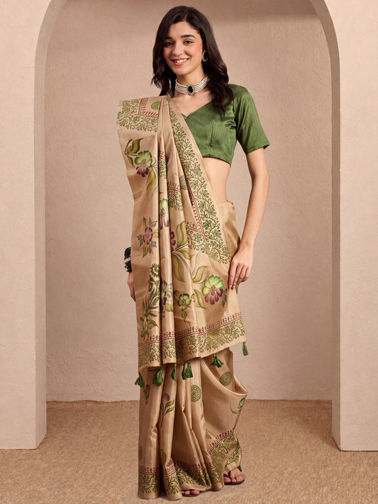 Woman wearing beige silk blend saree with hand-painted motif work and green blouse
