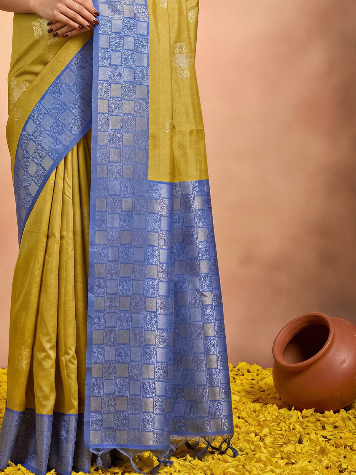 Pallu detail of olive cotton blend saree showing traditional indian motif work and zari border