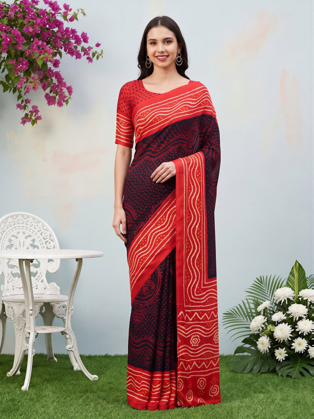 Woman wearing black satin silk saree with bandhani tie-dye dot work and red blouse