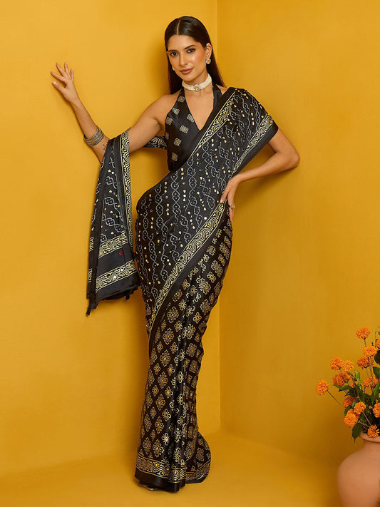 Woman wearing black satin silk saree with ajrak block-print motif work and black blouse