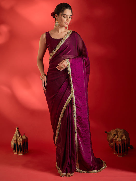 Woman wearing wine satin saree with clean solid-tone finish and wine blouse
