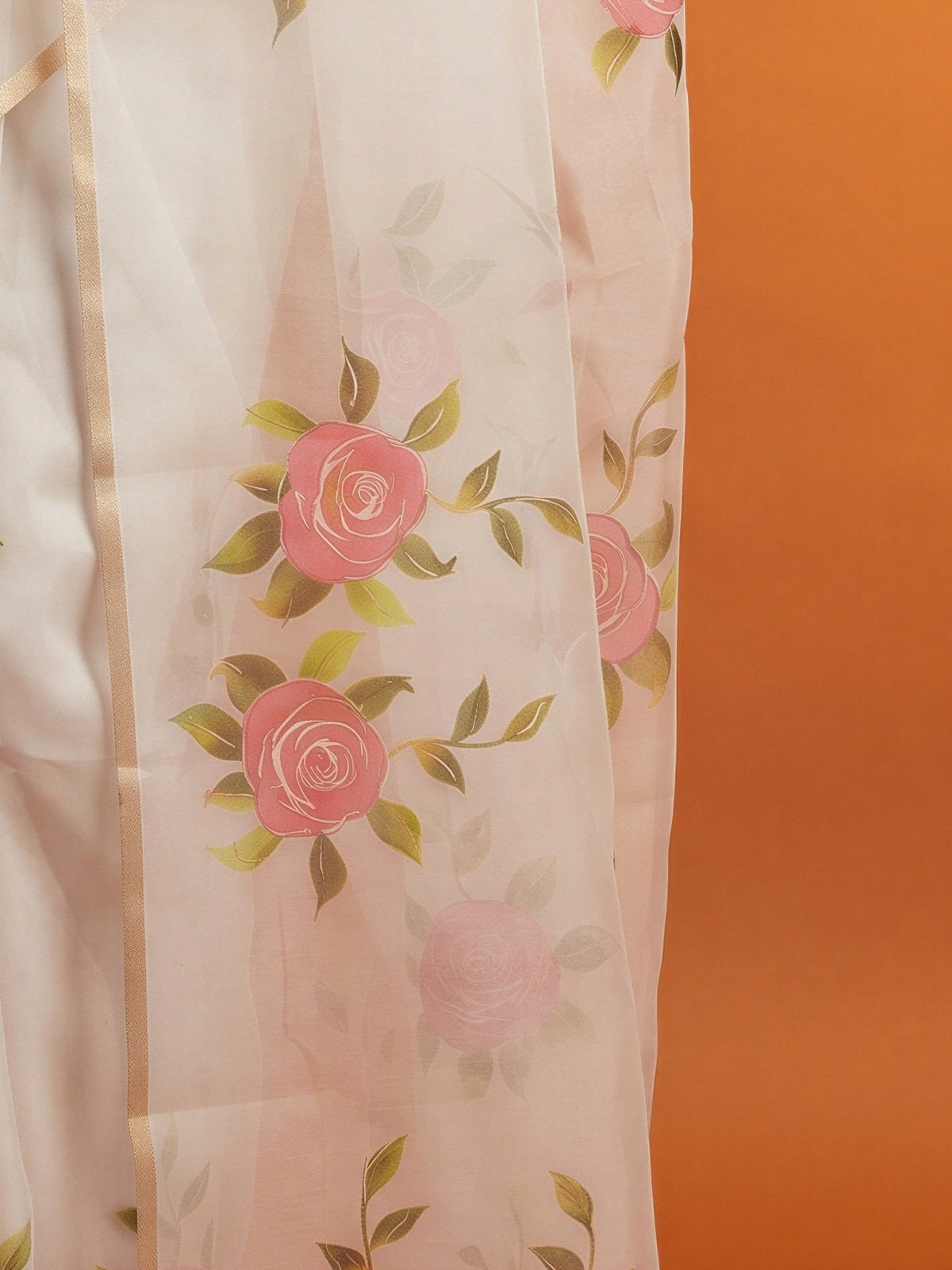 Pallu detail of white organza saree showing all-over floral design and zari border
