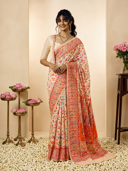 Woman wearing cream cotton silk saree with all-over floral design and cream blouse