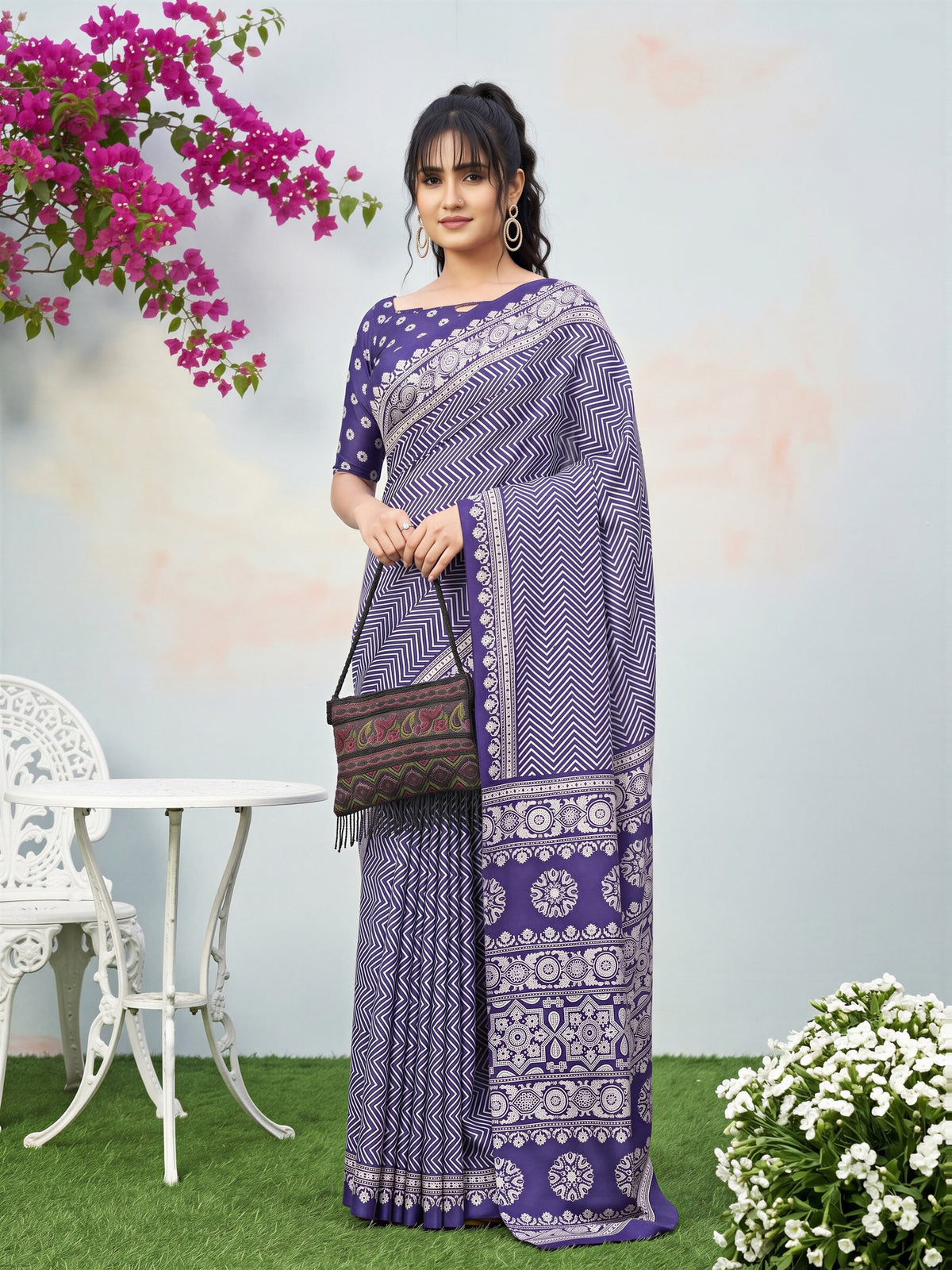 Woman wearing purple dola silk saree with ajrak block-print motif work and purple blouse