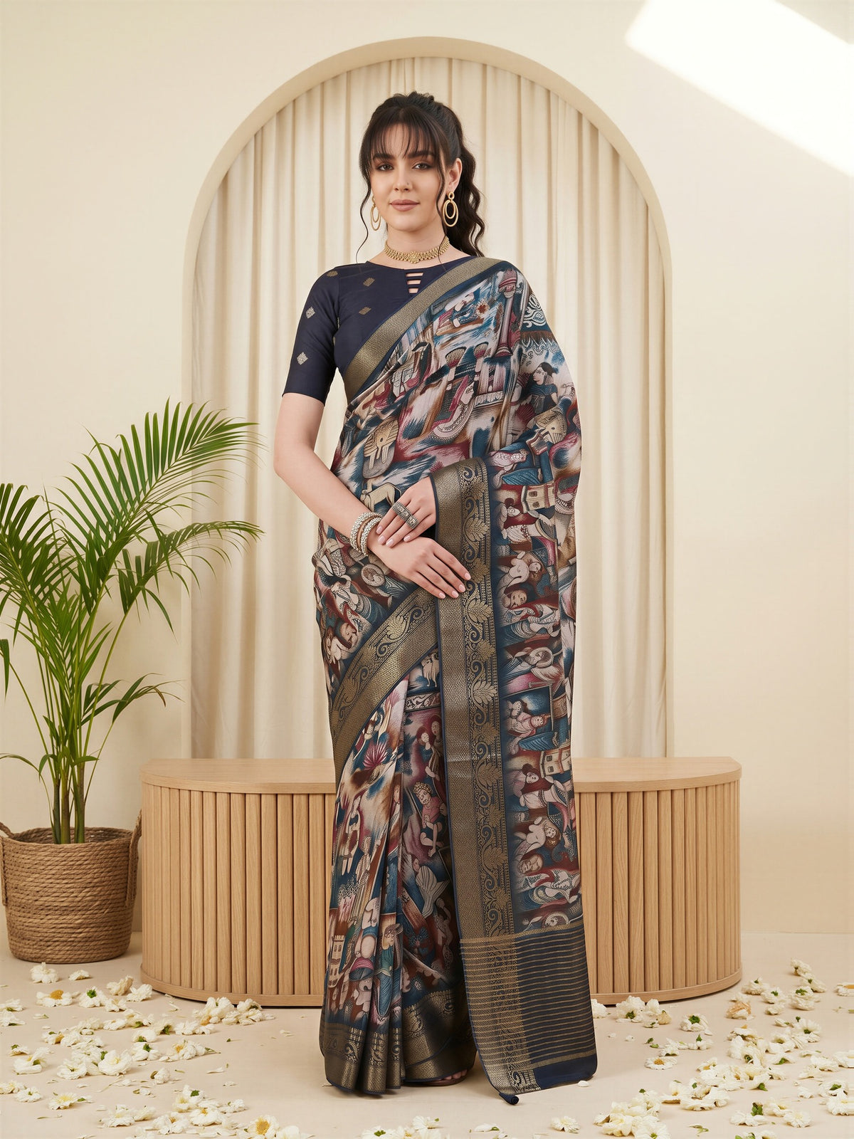 Woman wearing navy blue viscose silk saree with kalamkari narrative motif work and navy blue blouse