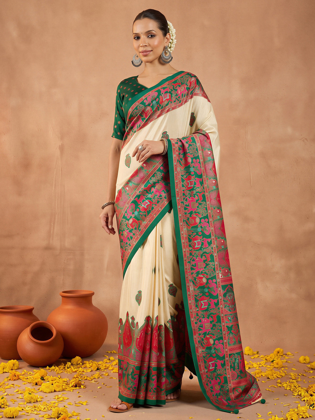Woman wearing dark green silk blend saree with metallic foil print work and dark green blouse