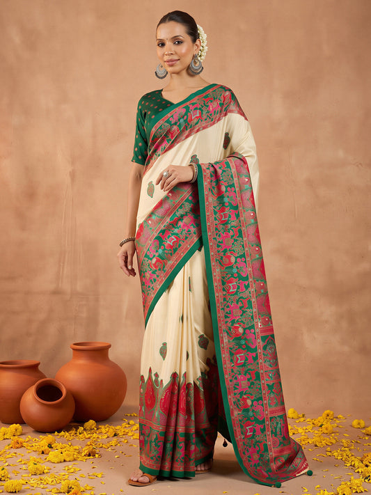 Woman wearing dark green silk blend saree with metallic foil print work and dark green blouse