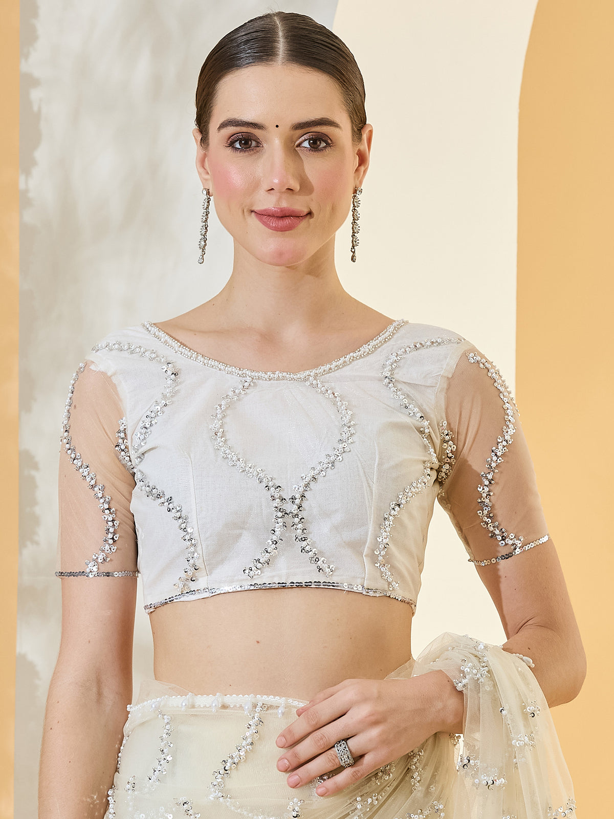 Unstitched off white net blouse piece with embellished design