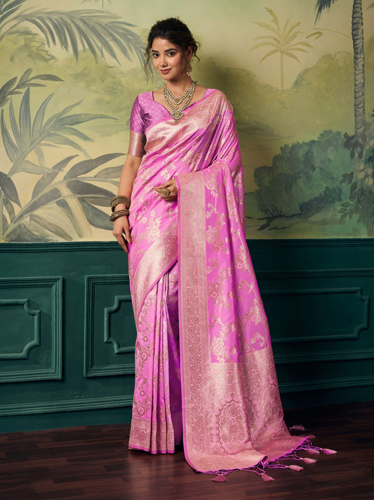 Woman wearing pink banarasi silk saree with woven motif design and pink blouse