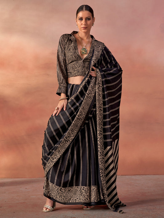 Woman wearing black silk blend saree with traditional indian motif work and black blouse