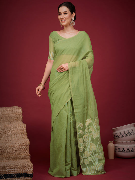Woman wearing light green soft silk saree with clean solid-tone finish and light green blouse