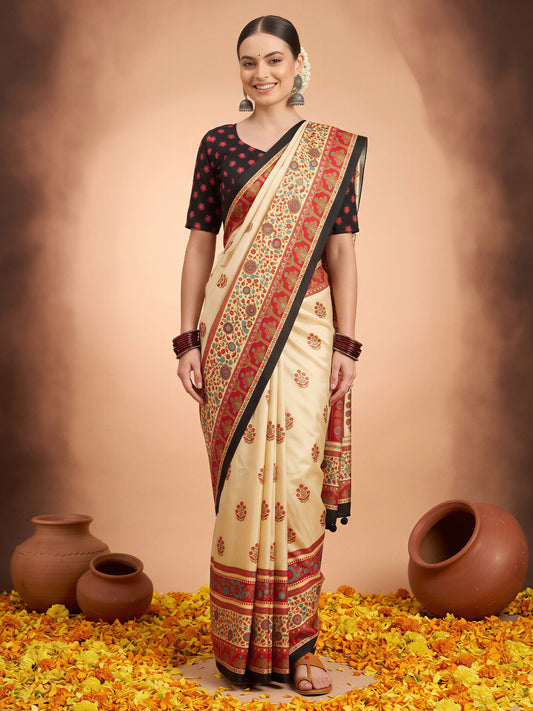 Woman wearing cream silk blend saree with metallic foil print work and black blouse