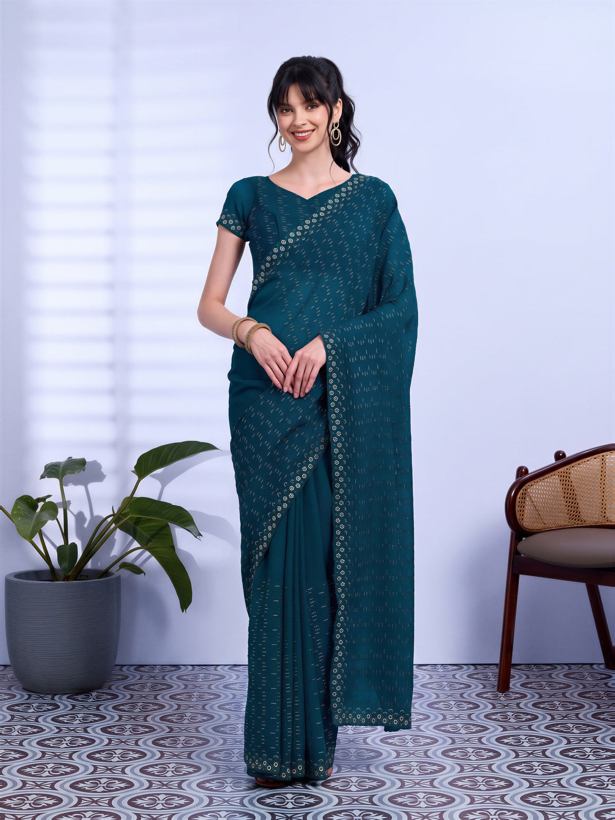 Woman wearing off white tissue saree with ornamented surface design and off white blouse