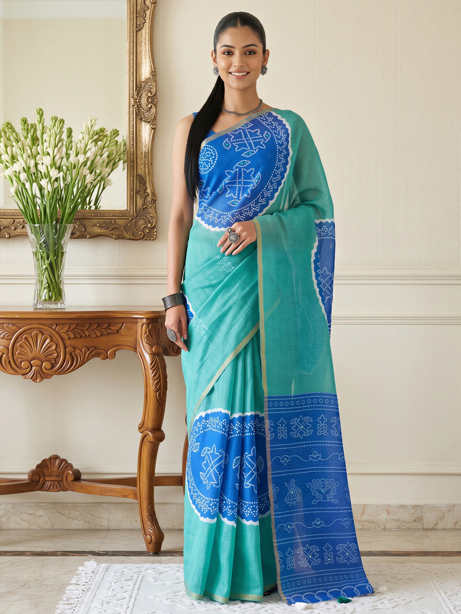 Woman wearing teal blue cotton blend saree with bandhani tie-dye dot work and blue blouse