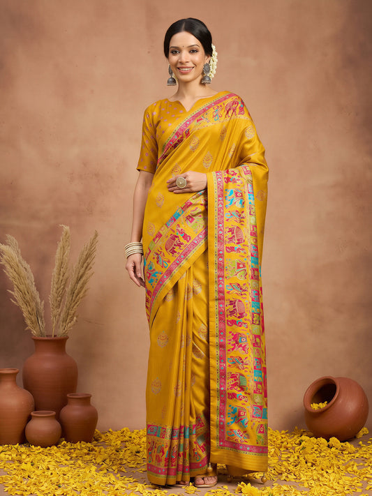 Woman wearing yellow silk blend saree with metallic foil print work and yellow blouse