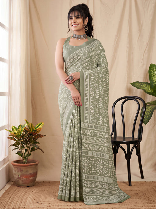 Woman wearing seagreen dola silk saree with warli folk-art figures and sea green blouse
