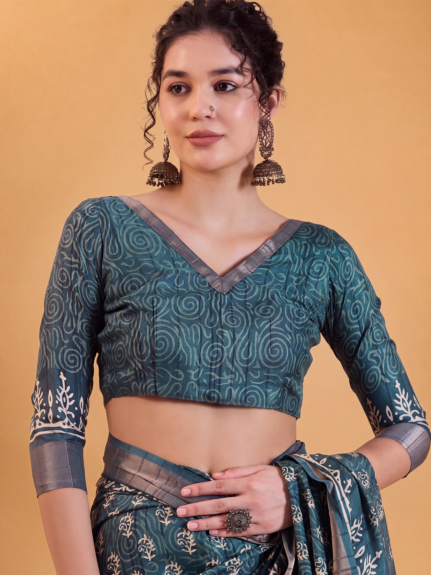 Unstitched teal blue silk blend blouse piece with dabu design