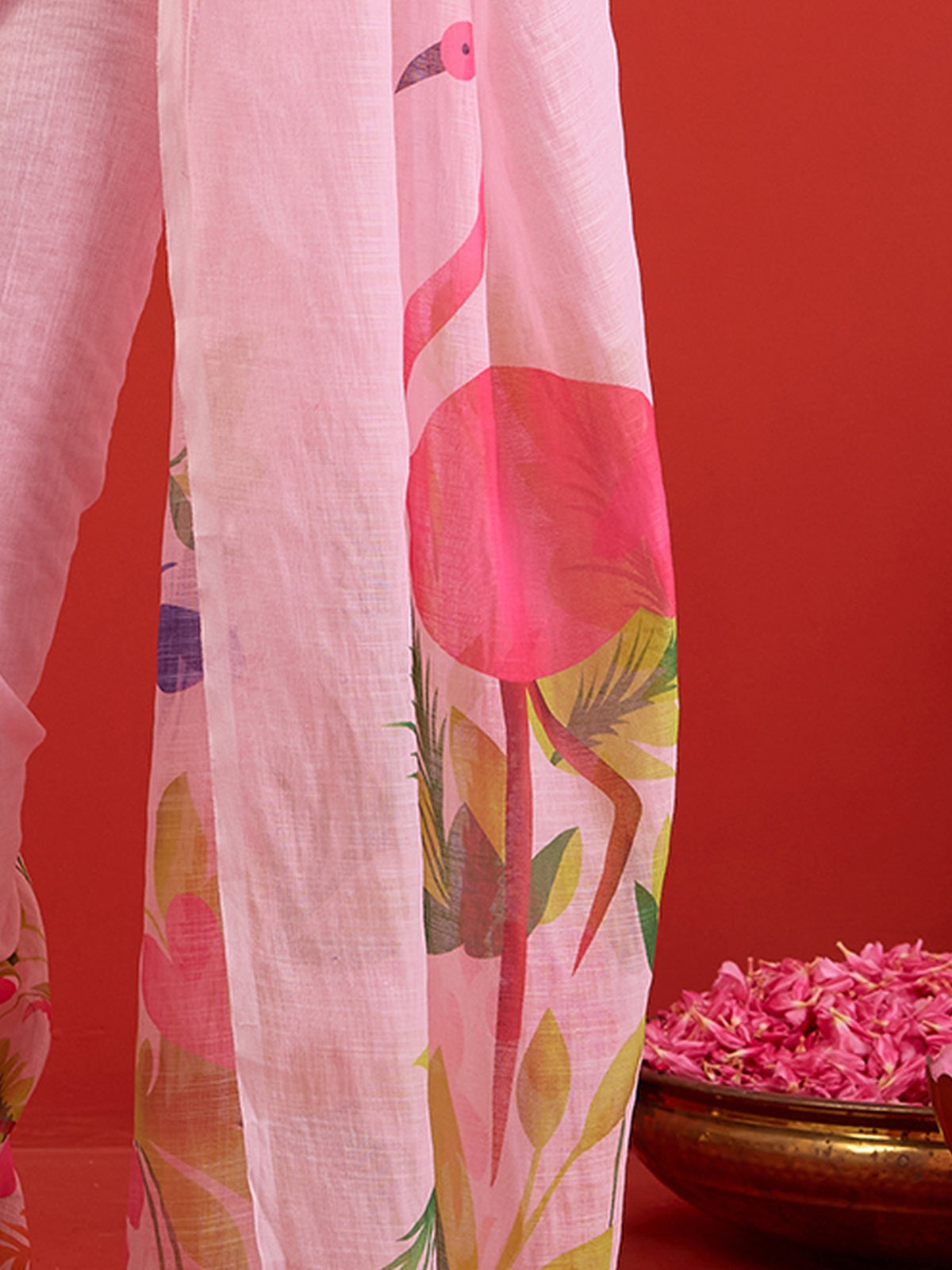 Pallu detail of pink linen saree showing all-over floral design and printed border
