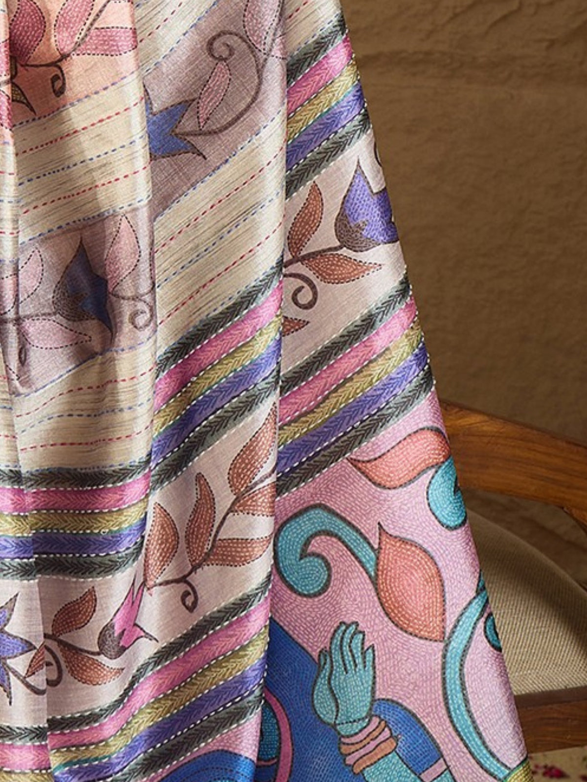 Pallu detail of multicolored art silk saree showing kalamkari narrative motif work and printed border