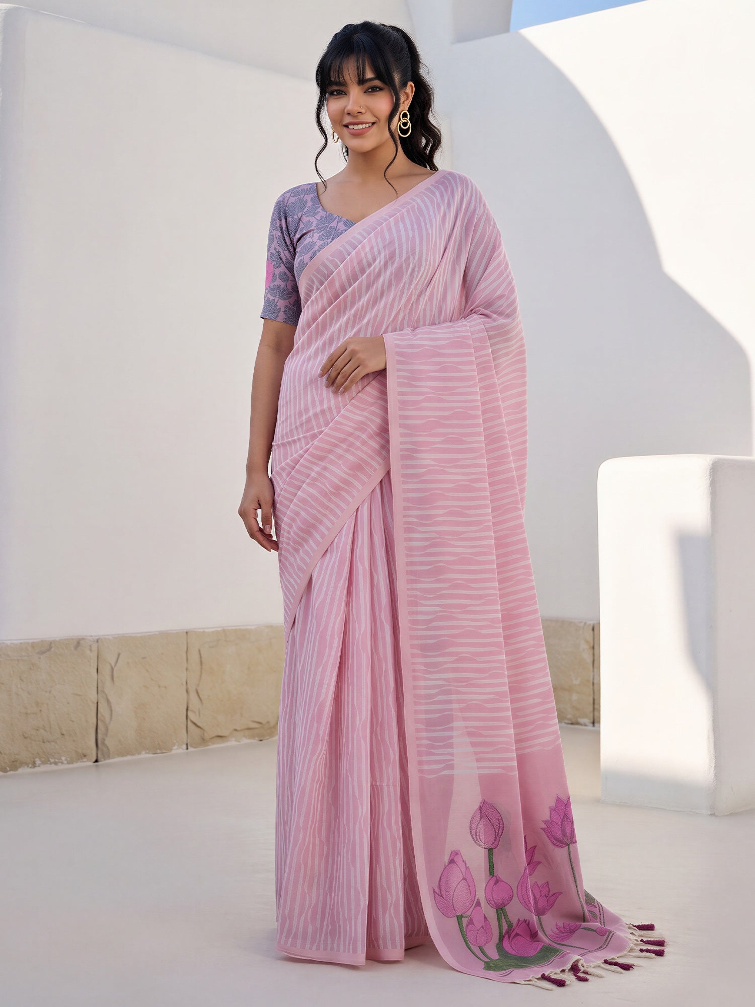 Woman wearing pink viscose saree with traditional indian motif work and pink blouse