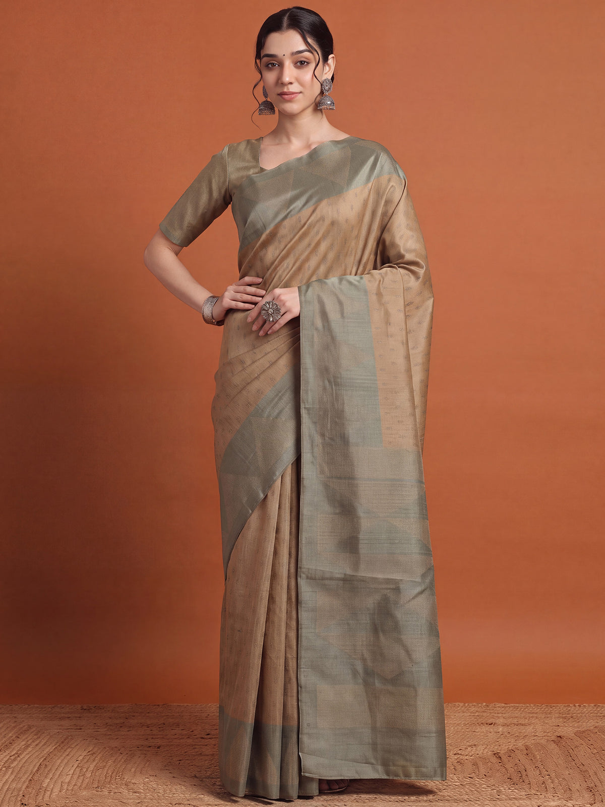 Woman wearing olive silk blend saree with metallic foil print work and olive blouse