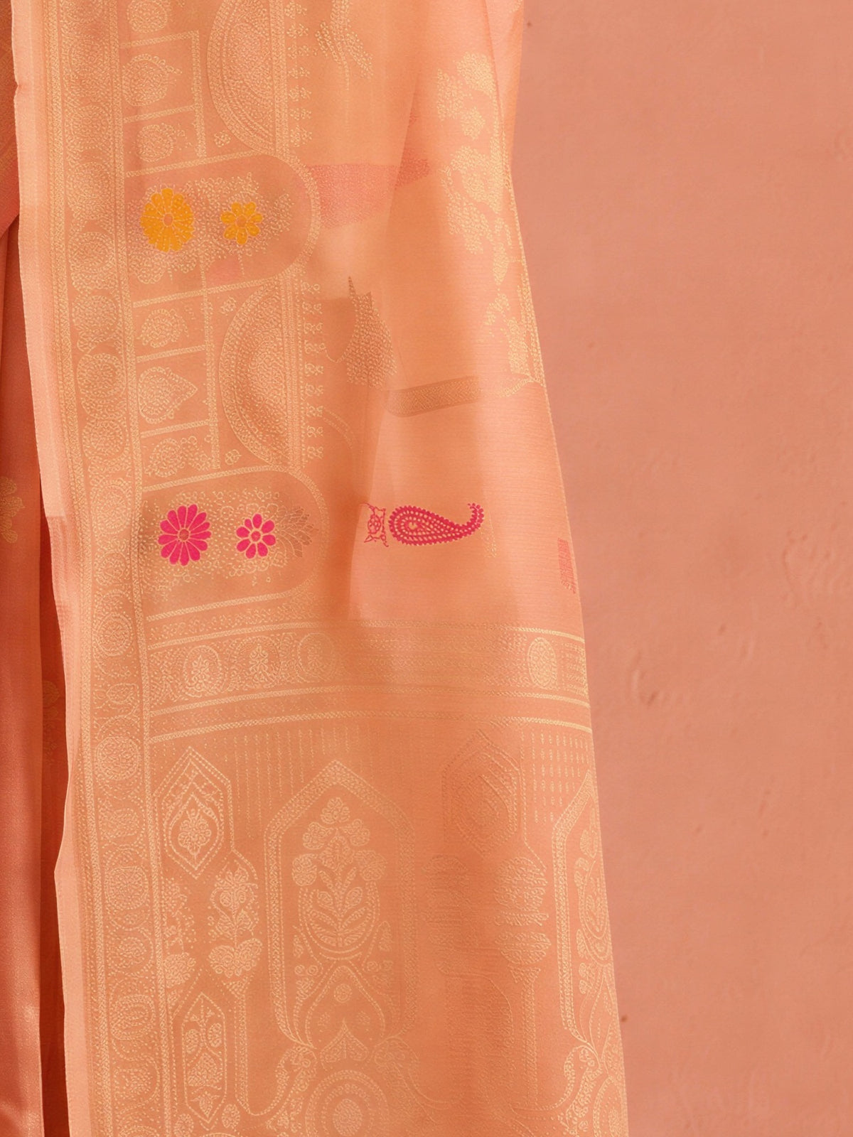 Pallu detail of peach silk blend saree showing traditional indian motif work and zari border