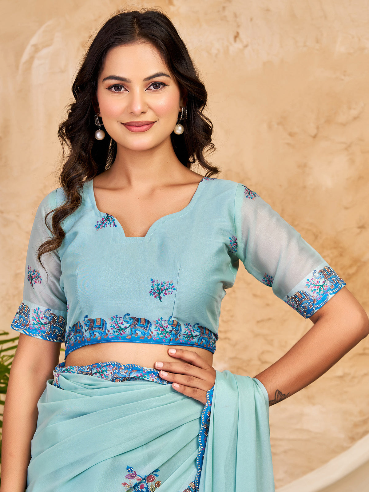 Unstitched light blue georgette blouse piece with ethnic motif design