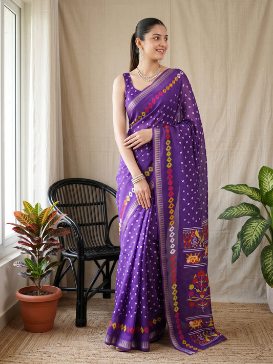 Woman wearing purple georgette saree with bandhani tie-dye dot work and purple blouse