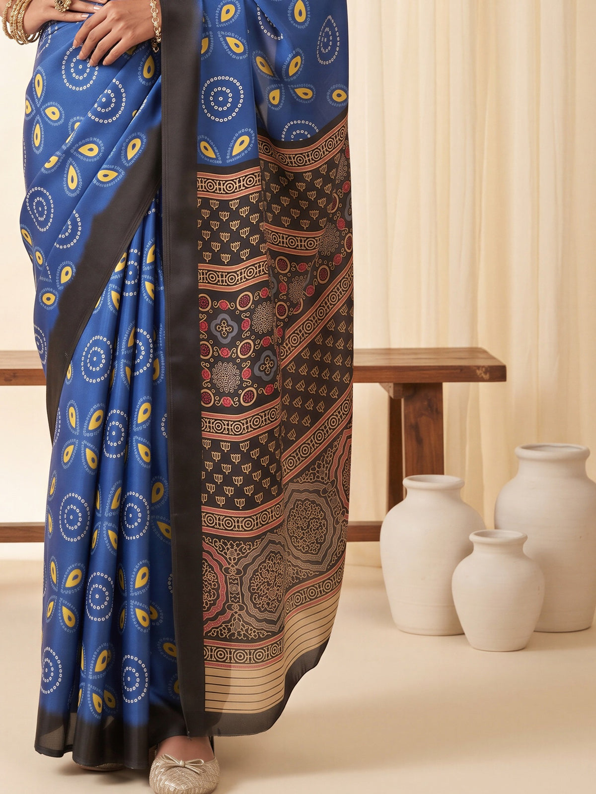 Pallu detail of blue satin saree showing bagh block-print motif work and printed border