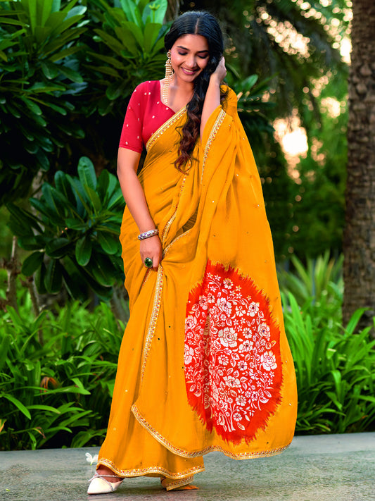 Mustard embroidered chiffon saree with red blouse piece