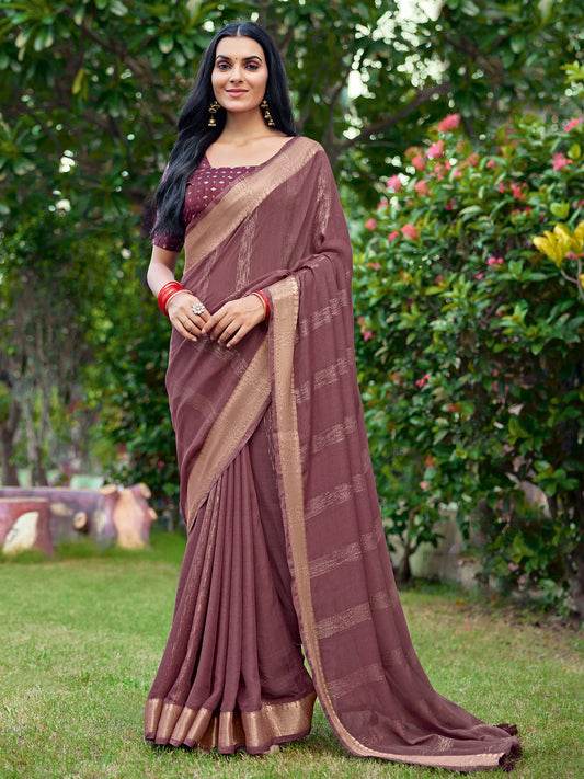 Woman wearing coffee brown georgette saree with striped pattern design and coffee brown blouse