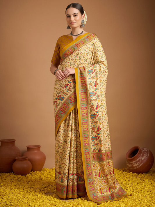 Woman wearing cream silk blend saree with metallic foil print work and mustard blouse