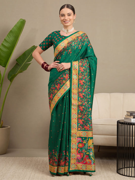 Woman wearing dark green silk blend saree with metallic foil print work and dark green blouse