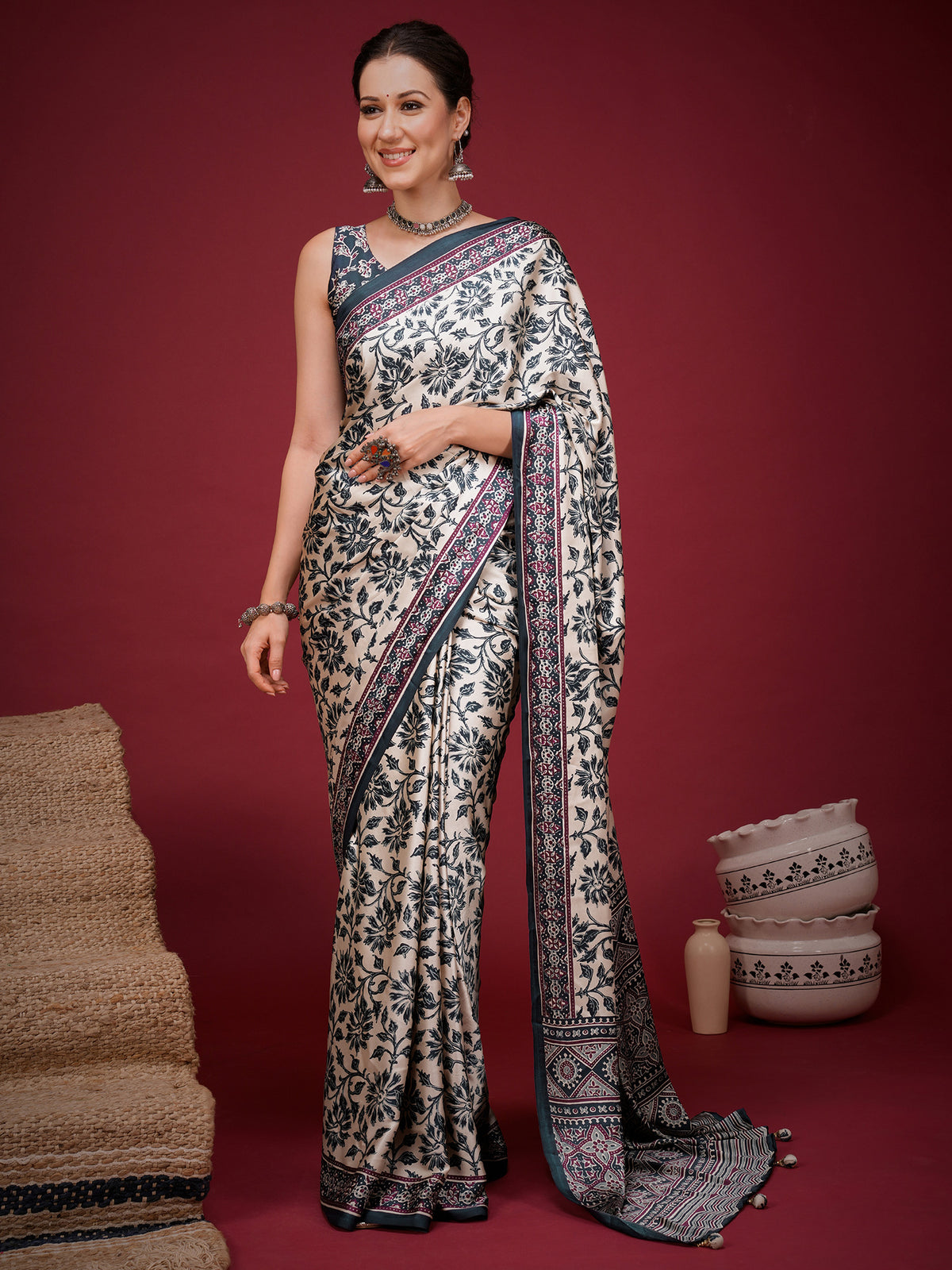 Woman wearing cream satin saree with ajrak block-print motif work and navy blue blouse