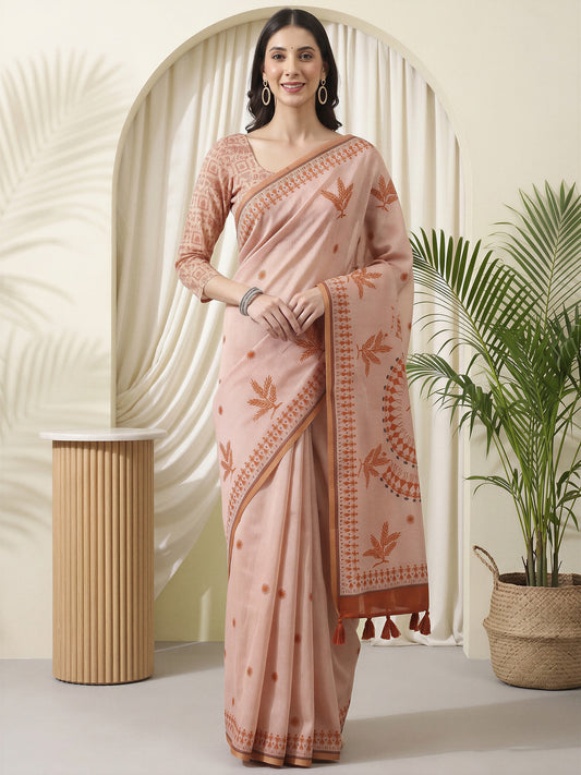Woman wearing rust cotton linen saree with warli folk-art figures and rust blouse