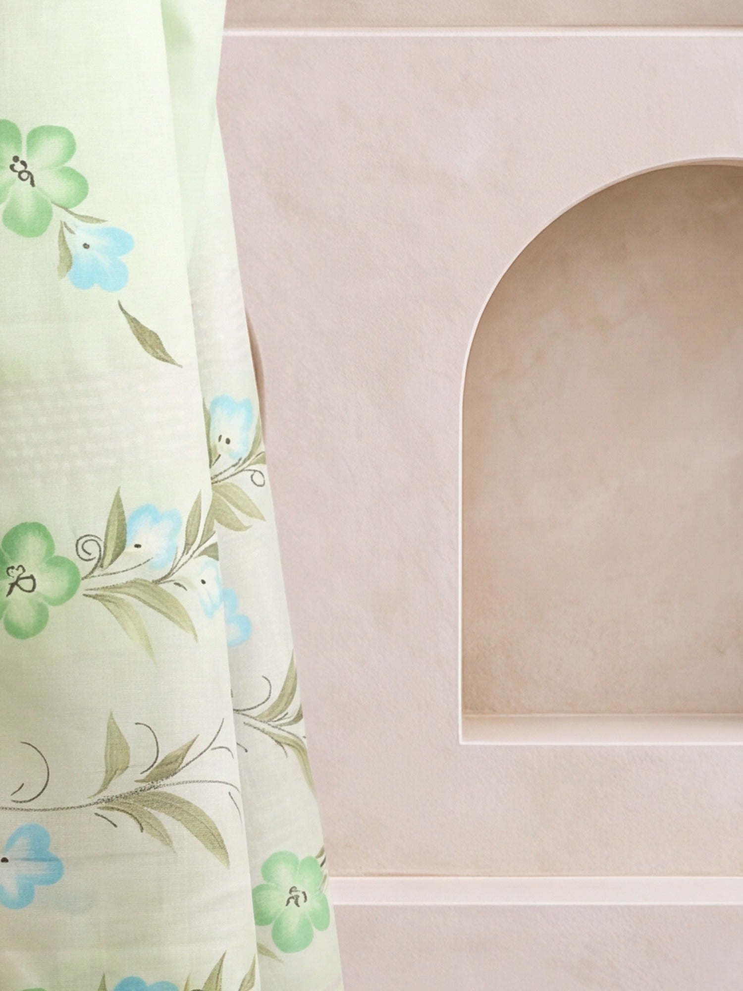 Pallu detail of turquoise linen saree showing traditional indian motif work and printed border