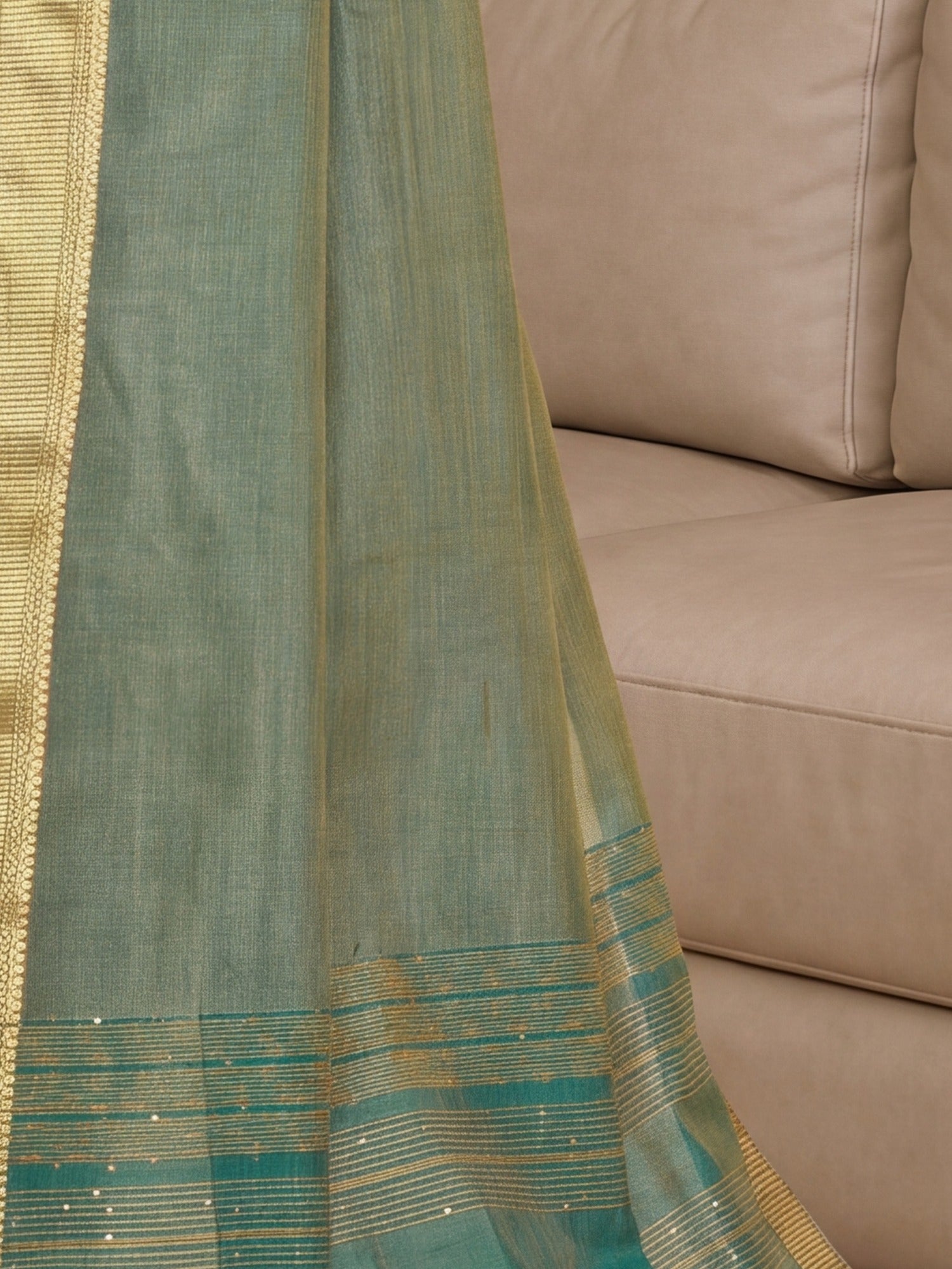 Pallu detail of sea green cotton silk saree showing clean solid-tone finish and zari border