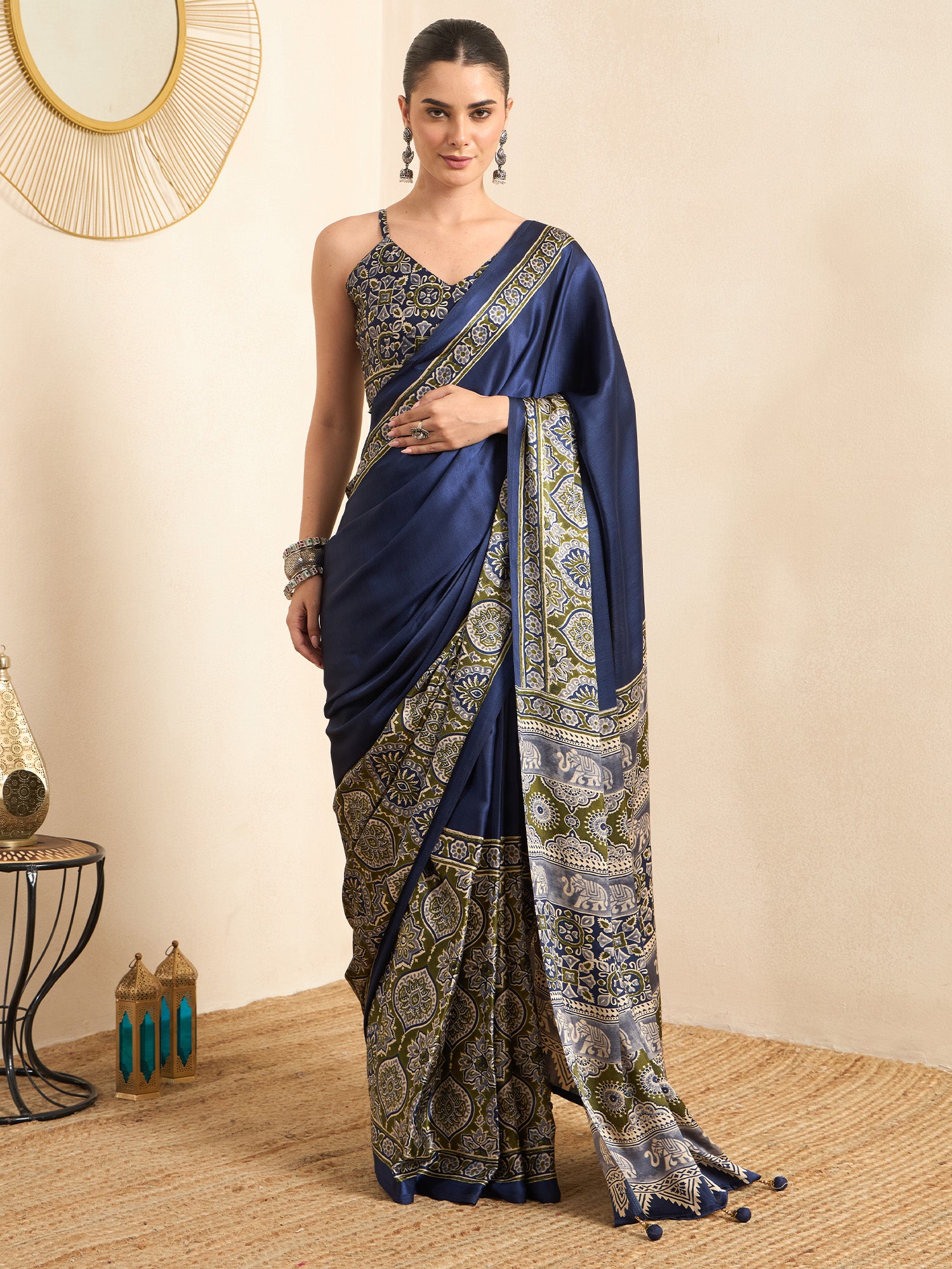 Woman wearing blue crepe saree with ajrak block-print motif work and blue blouse