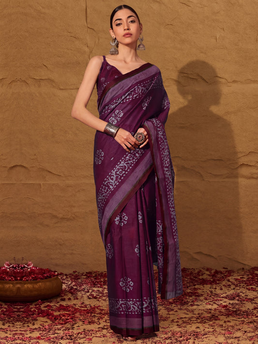 Woman wearing wine cotton saree with batik wax-resist design and wine blouse