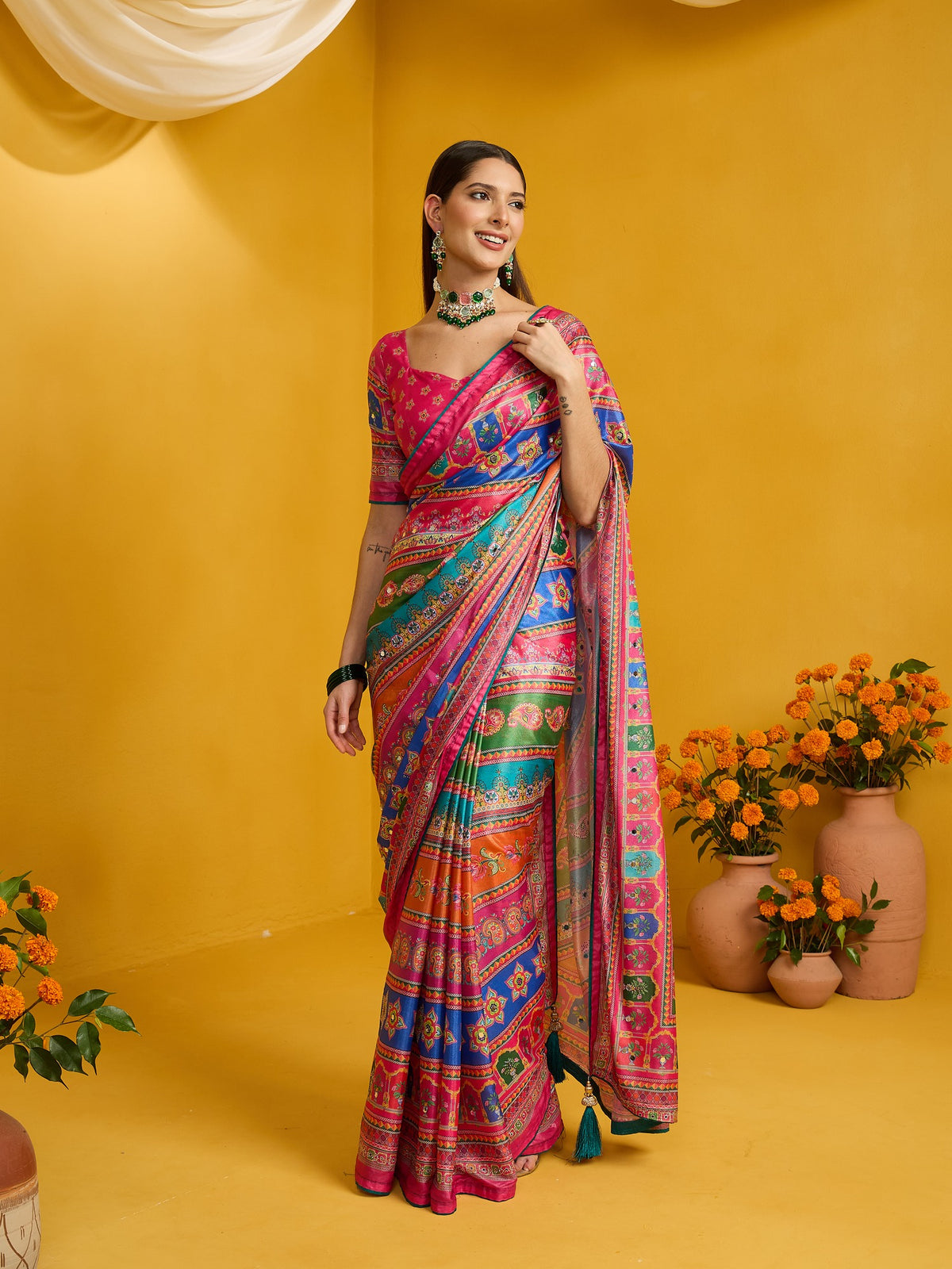 Woman wearing pink silk blend saree with ornamented surface design and pink blouse