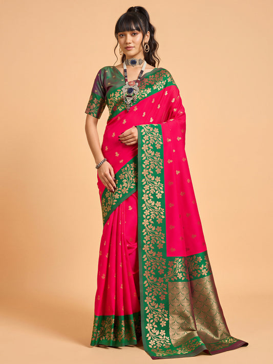 Woman wearing pink cotton blend saree with all-over floral design and green blouse
