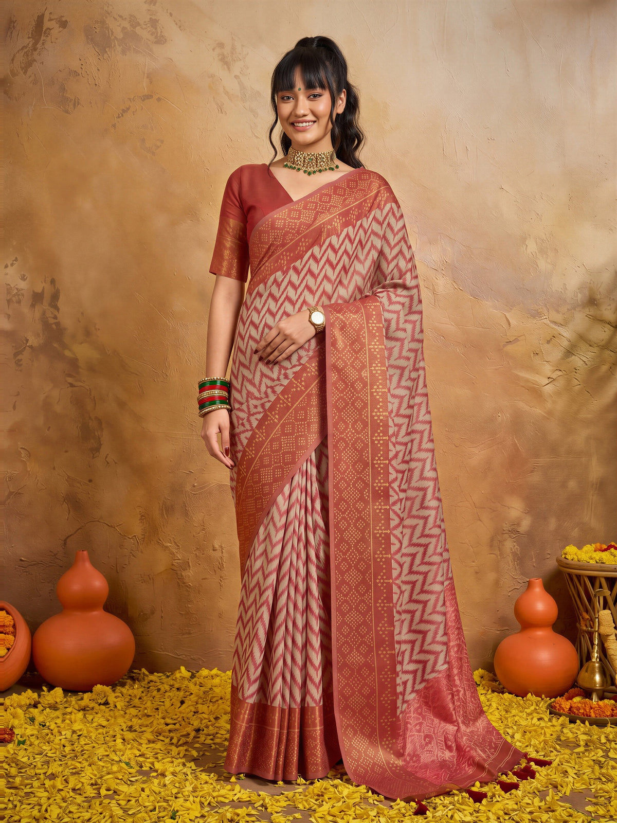 Woman wearing orange viscose saree with geometric pattern design and orange blouse