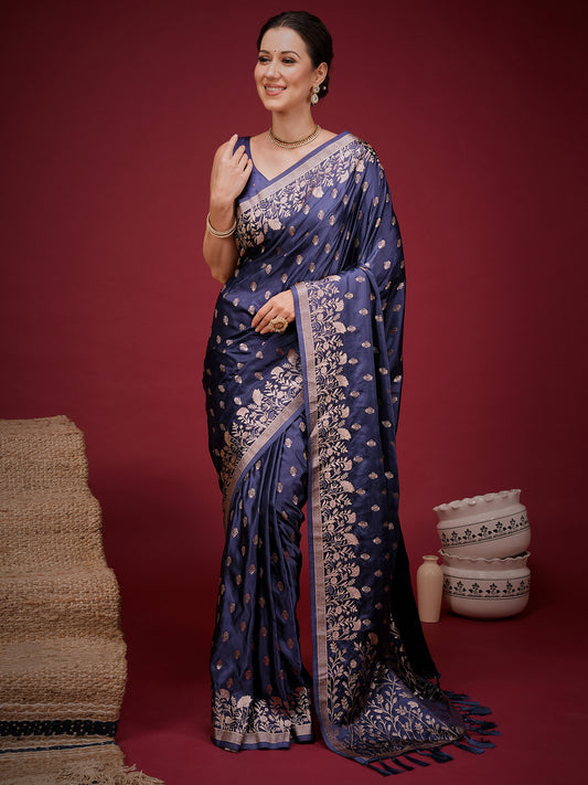 Woman wearing navy blue silk blend saree with zari butta (metallic motif) work and navy blue blouse
