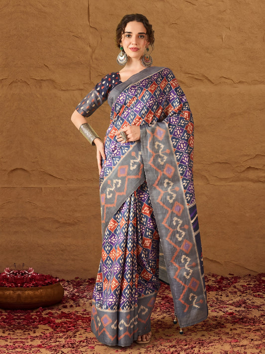 Woman wearing navy blue silk blend saree with ikat resist-dyed pattern and navy blue blouse